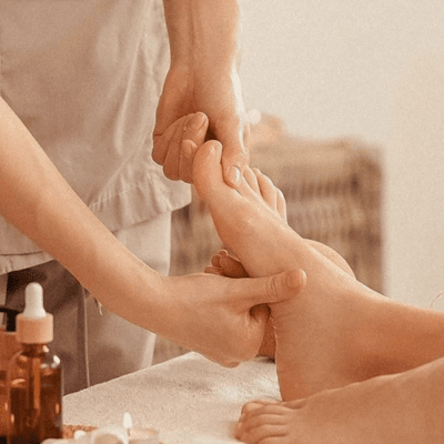 Aromatic massage oils and natural elements arranged in a treatment room at Anantara Spa